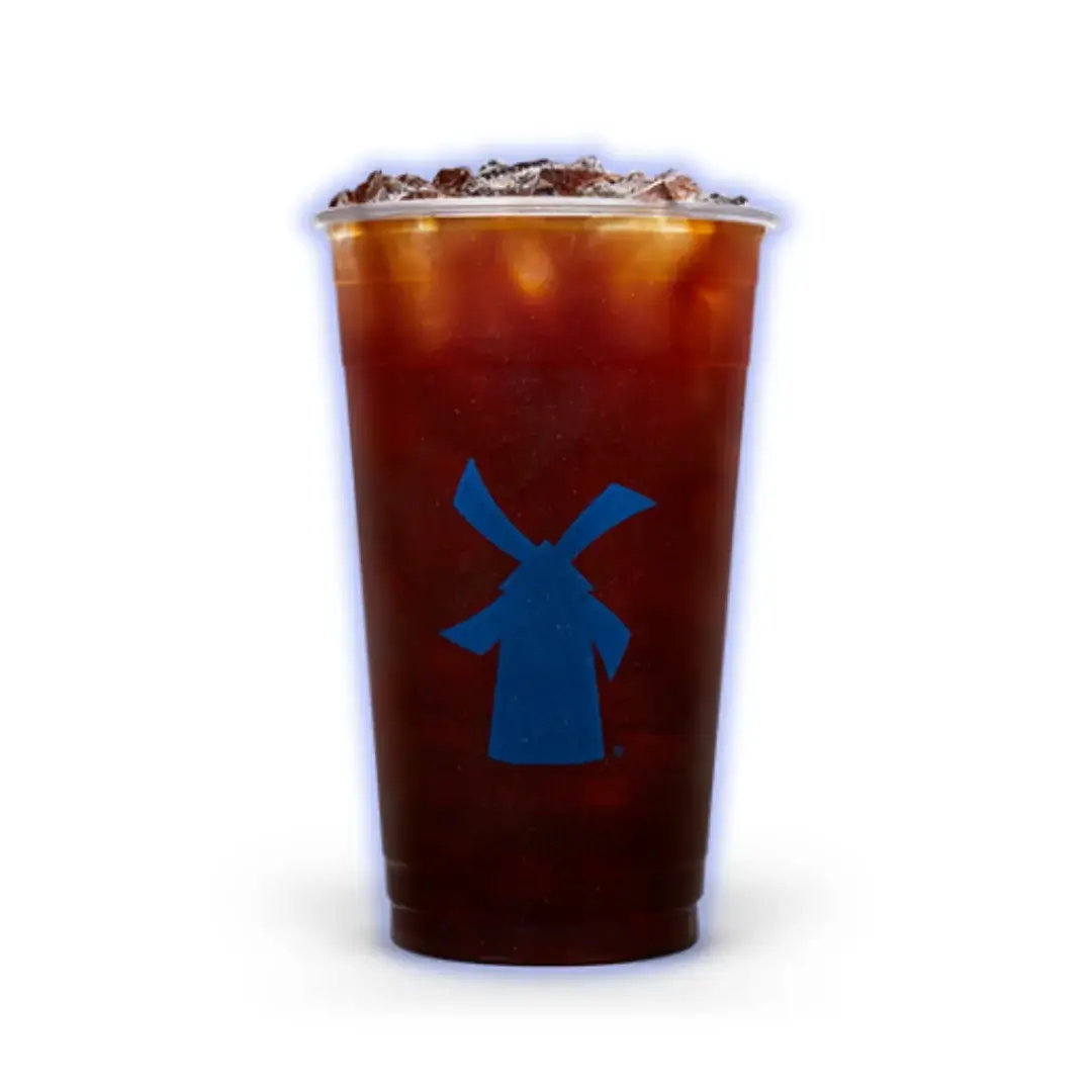 Hot Americano with a rich, bold flavor served in a clear cup.