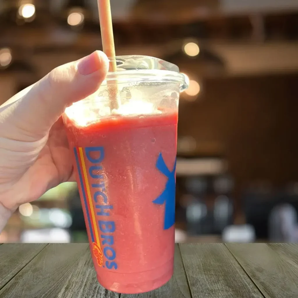 A person show Wildberry Smoothie in her hand